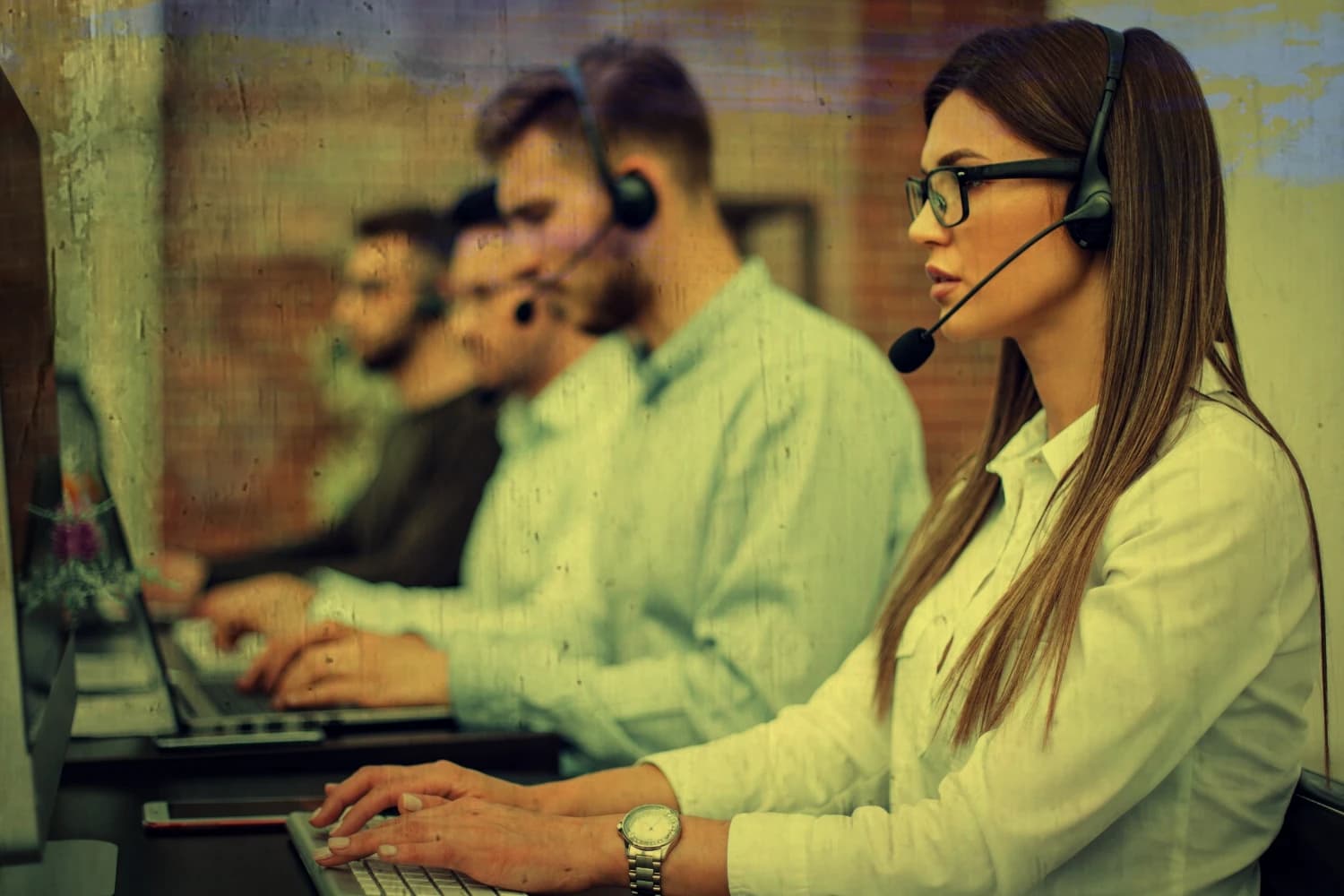 woman working at a call center wearing a headset